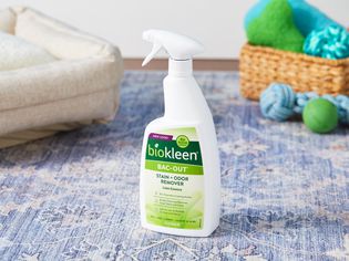 Biokleen Bac-Out Stain + Odor Remover Foaming Action Spray displayed on blue carpet